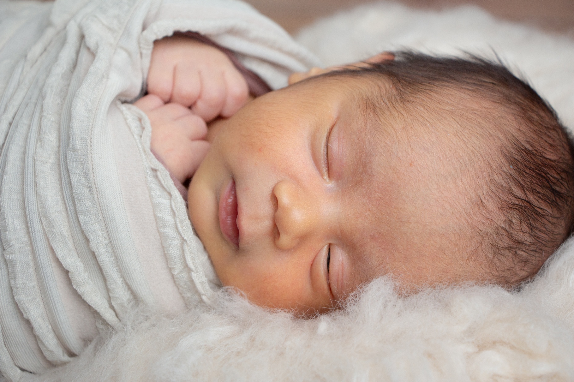 Close-up of a sleeping newborn's face